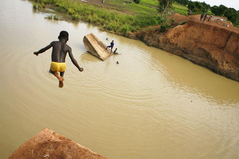 Children use the destroyed Temda Bridge, which collapsed on August 24th 2007, as a playground in Tepane District- Northeastern Ghana. This bridge, which lies 40km from the border of Burkina Faso.