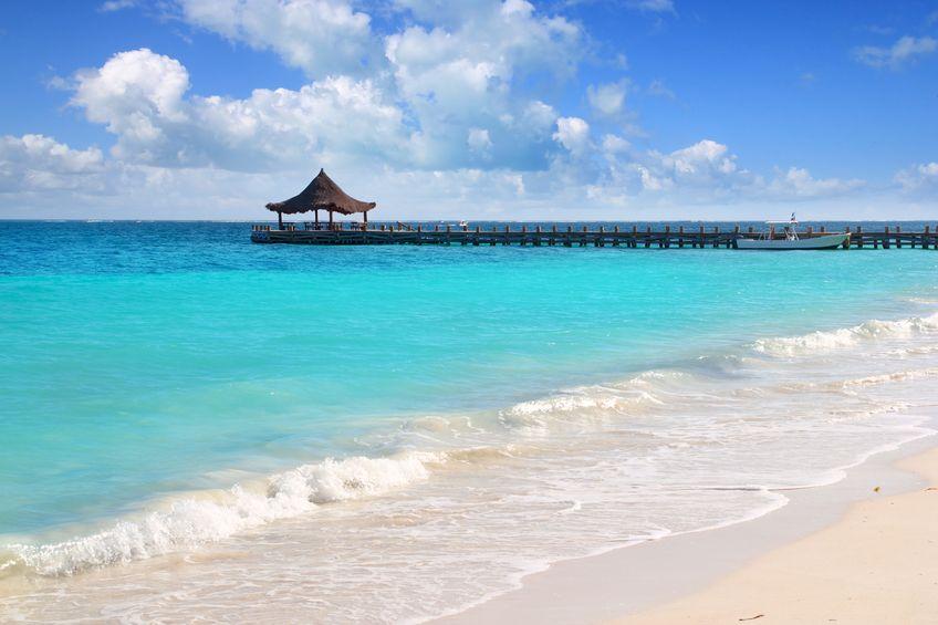 Caribbean sea truquoise beach pier hut Mayan Riviera Puerto Morelos Mexico