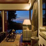 The lounge of one of the pool villas at The Damai at night.