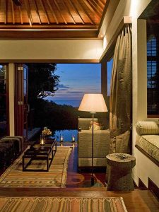 The lounge of one of the pool villas at The Damai at night.