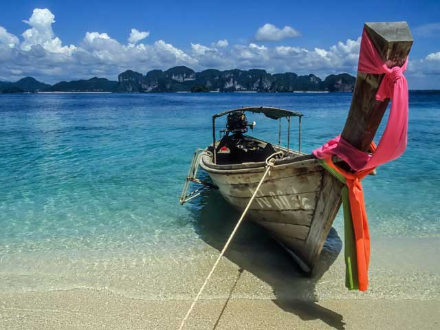 A long tail boat on one of Phukets many beaches.