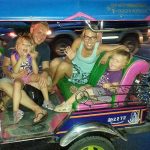 The team from ants-in-our-pants.com gathered in a tuk-tuk in Thailand.
