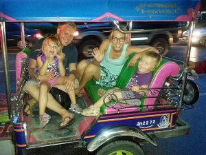 The team from ants-in-our-pants.com gathered in a tuk-tuk in Thailand.