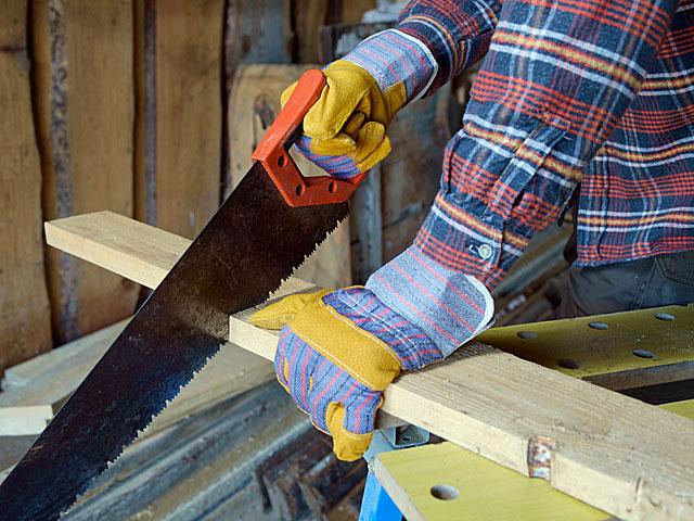 Man sawing a log - is this the new luxury in travel?