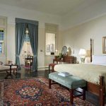 The bedroom in a Courtyard Suite at Raffles Hotel, Singapore.