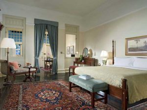 The bedroom in a Courtyard Suite at Raffles Hotel, Singapore.