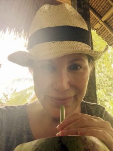 Karin is detoxing on Bali, here sipping on fresh coconut.
