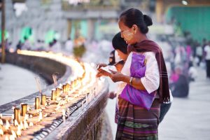 Women saving prayers at Schwedagon Pagoda in Yangon, Myanmar (aka Burma)