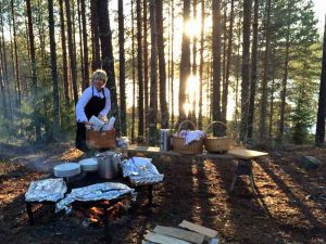 Chef preparing an outdoor lunch at Camp Sävenfors, Sweden.