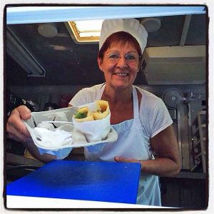 Chef Birgitta "Bee" Andersson is serving delicious Swedish pancakes with a smile and some attitude.