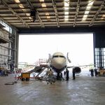 Airplane parked in a hangar.