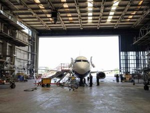 Airplane parked in a hangar.