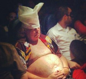 half naked fat man on airplane